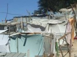 A tent city of bed sheets and wooden posts in Port-au-Prince, Haiti. Flavia Cherry photo