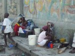 Haitian women and children huddle on the streets of Port-au-Prince - Flavia Cherry photo.