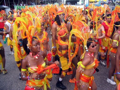 Carnival Masqueraders in Trinidad (Wikipedia).