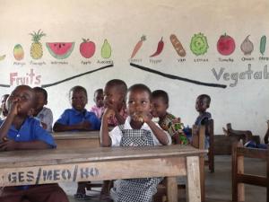 Ghanaian children in school aided by DIVOG.